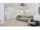 Spacious loft area with seating and ceiling fan at 33443 Landsman Loop, Wesley Chapel, FL 33543