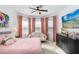 Main bedroom with pink accents and ample natural light at 33443 Landsman Loop, Wesley Chapel, FL 33543