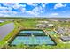 Well-lit tennis and pickleball courts at 33443 Landsman Loop, Wesley Chapel, FL 33543