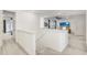 Upstairs hallway with access to bedrooms and loft area at 33443 Landsman Loop, Wesley Chapel, FL 33543