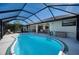 Relaxing kidney-shaped pool with screened enclosure at 36 Santarem Cir, Punta Gorda, FL 33983