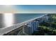 Aerial view of beachfront high rise condos with ocean and shoreline views at 415 L Ambiance Dr # F608, Longboat Key, FL 34228