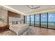 Bright bedroom with hardwood floors and ocean views at 415 L Ambiance Dr # F608, Longboat Key, FL 34228