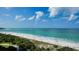 Stunning ocean and beach view from condo with lush greenery at 415 L Ambiance Dr # F608, Longboat Key, FL 34228