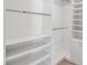 Large walk-in closet with white shelves, drawers, and hanging rods at 4151 Via Sienna Cir, Sarasota, FL 34243