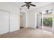 Spacious bedroom with carpet and sliding glass doors at 4264 Central Sarasota Pkwy # 111, Sarasota, FL 34238