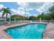 Refreshing community pool with lounge chairs at 4264 Central Sarasota Pkwy # 111, Sarasota, FL 34238