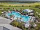 Aerial view of resort-style pool with lounge chairs and cabanas at 4611 Trento Pl, Bradenton, FL 34211