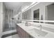 Spacious bathroom with dual sinks, large shower, and modern lighting at 52 Audubon Pl # 52, Sarasota, FL 34237