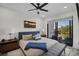 Relaxing bedroom with sliding glass doors to a balcony and a comfortable bed at 52 Audubon Pl # 52, Sarasota, FL 34237