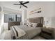 Cozy bedroom with a comfortable bed, nightstands, and a ceiling fan at 52 Audubon Pl # 52, Sarasota, FL 34237