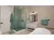 Modern bathroom with glass shower, vanity, and freestanding tub at 609 Dundee Ln, Holmes Beach, FL 34217