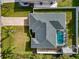 Aerial view showing house, pool, and surrounding landscape at 6261 Keating Ave, North Port, FL 34291