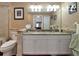 Double vanity bathroom with granite countertops at 6261 Keating Ave, North Port, FL 34291