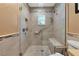 Updated bathroom with a walk-in shower and built-in seat at 6261 Keating Ave, North Port, FL 34291