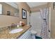 Clean bathroom, granite countertop, and shower/tub combo at 6261 Keating Ave, North Port, FL 34291
