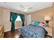 Bright bedroom with a double bed and ceiling fan at 6261 Keating Ave, North Port, FL 34291
