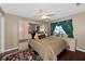 Bedroom with mirrored wardrobe and ceiling fan at 6261 Keating Ave, North Port, FL 34291