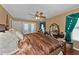 King bedroom with wood floors and ceiling fan at 6261 Keating Ave, North Port, FL 34291