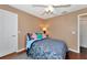 Well-lit bedroom with double bed and ceiling fan at 6261 Keating Ave, North Port, FL 34291