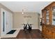 Bright entryway with hardwood floors, a console table, and a china cabinet at 6261 Keating Ave, North Port, FL 34291