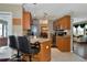 Kitchen with breakfast bar and view into the living room at 6261 Keating Ave, North Port, FL 34291