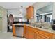 Spacious kitchen featuring granite countertops and wood cabinets at 6261 Keating Ave, North Port, FL 34291