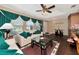 Living room with hardwood floors, a sofa, and a view of the entryway at 6261 Keating Ave, North Port, FL 34291