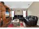Spacious living room with hardwood floors and a large entertainment center at 6261 Keating Ave, North Port, FL 34291