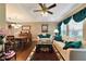 Living room with hardwood floors, a sofa, and a dining area at 6261 Keating Ave, North Port, FL 34291
