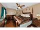 Large main bedroom with hardwood floors and a ceiling fan at 6261 Keating Ave, North Port, FL 34291