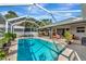 Relaxing screened pool area with a view of the backyard at 6261 Keating Ave, North Port, FL 34291
