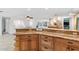 Island kitchen features granite countertops and wood cabinets at 6623 Glades Way, Sarasota, FL 34231