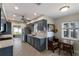 Modern kitchen with gray cabinets, quartz countertops, and breakfast nook at 6727 Anchor Way, Sarasota, FL 34231