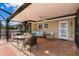 Relaxing covered patio with seating area, adjacent to the pool at 6727 Anchor Way, Sarasota, FL 34231