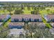 Complex of attached villas with lush green surroundings at 6908 Drewrys Blf # 711, Bradenton, FL 34203