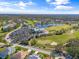 Aerial view of community, golf course, and clubhouse at 6908 Drewrys Blf # 711, Bradenton, FL 34203