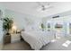 Bright bedroom with king-size bed and large windows at 6908 Drewrys Blf # 711, Bradenton, FL 34203