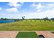 Scenic driving range with a pond and lush landscaping at 6908 Drewrys Blf # 711, Bradenton, FL 34203