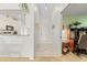 Bright entryway with tile flooring, kitchen peek, and office space at 6908 Drewrys Blf # 711, Bradenton, FL 34203