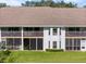 Two-story villa with screened balconies and lush lawn at 6908 Drewrys Blf # 711, Bradenton, FL 34203