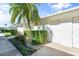 White building exterior with landscaping and private access at 6908 Drewrys Blf # 711, Bradenton, FL 34203