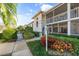 Condo building exterior with walkway and landscaping at 6908 Drewrys Blf # 711, Bradenton, FL 34203