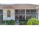 Two-story condo building with balconies and lush landscaping at 6908 Drewrys Blf # 711, Bradenton, FL 34203