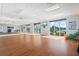 Bright fitness room with wood floors and large windows at 6908 Drewrys Blf # 711, Bradenton, FL 34203