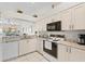 Well-equipped kitchen with granite countertops at 6908 Drewrys Blf # 711, Bradenton, FL 34203
