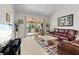 Spacious living room with leather furniture and view of balcony at 6908 Drewrys Blf # 711, Bradenton, FL 34203