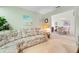 Comfortable den with sectional sofa and view into dining area at 6908 Drewrys Blf # 711, Bradenton, FL 34203