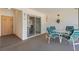Small screened patio with table and chairs at 6908 Drewrys Blf # 711, Bradenton, FL 34203