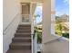 Carpeted condo staircase leading to exterior entrance at 6908 Drewrys Blf # 711, Bradenton, FL 34203